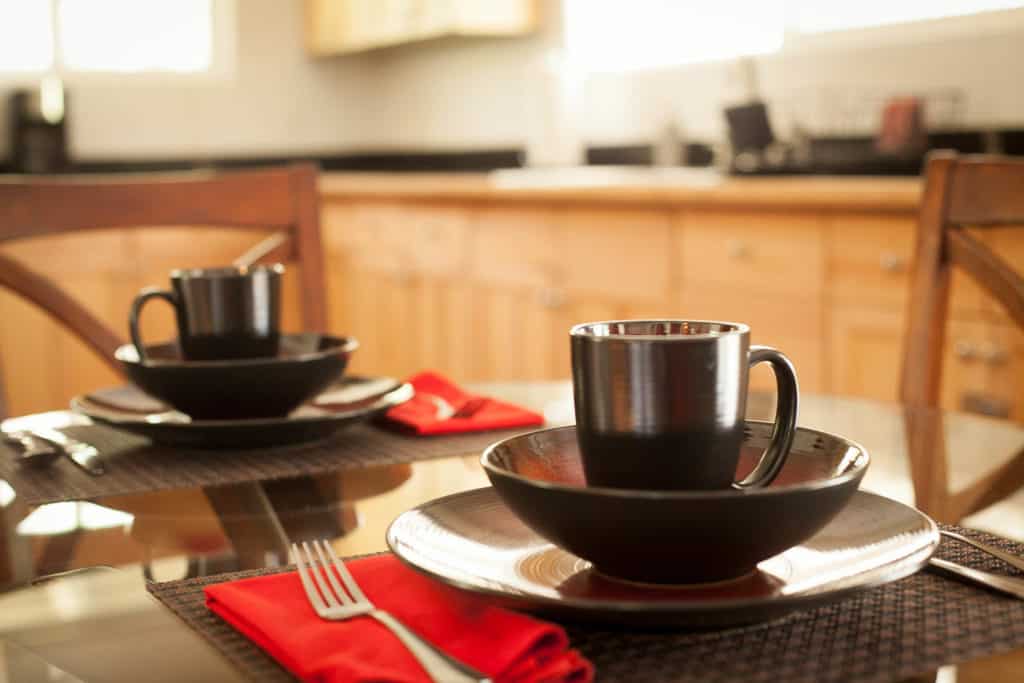 Our vacation rental has everything you need, coffee cups on a table in the kitchen.