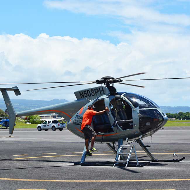 Big Island Helicopter tours getting in the helicopter.
