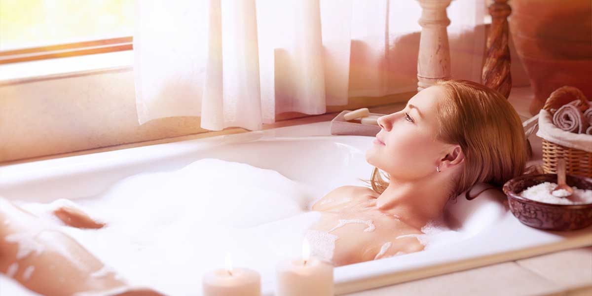 lady relaxing in a bath tub after her hawaii massage